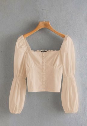 Top beige corto a maniche lunge